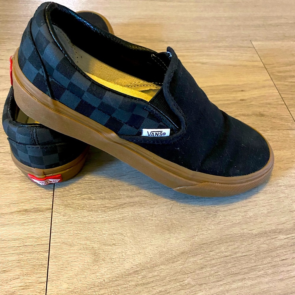 Custom made Vans universal size women’s 7W black checkered gum sole.